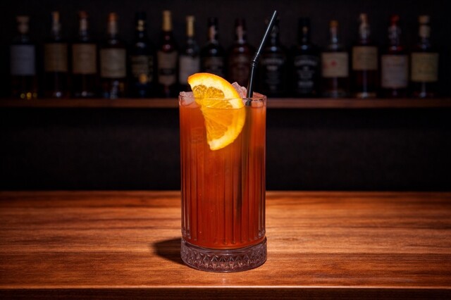 Mix of tequila, orange juice and grenadine with orange.